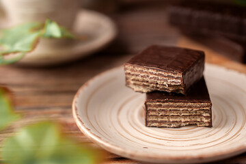 Chocolates with wafer filling and a cup of coffee