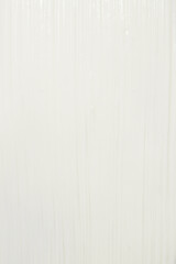 Thick white cosmetic cream applied to the surface. texture of the cream close-up.