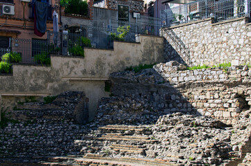 Close-up view of ruins of ancient roman Odeon theater in Taormina. Travel and tourism concept