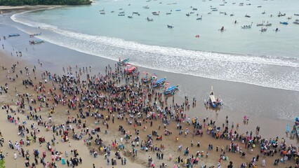 Pangandaran Beach, West Java, Indonesia. A stunning scene where a group of tourists celebrate the...