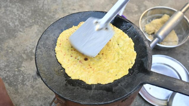 Making Mooli paratha or Radish flatbread. Healthy Indian Mooli paratha. Daikon flatbread. It is a popular food of india. It can be eaten for breakfast, lunch and dinner. Indian food. 
