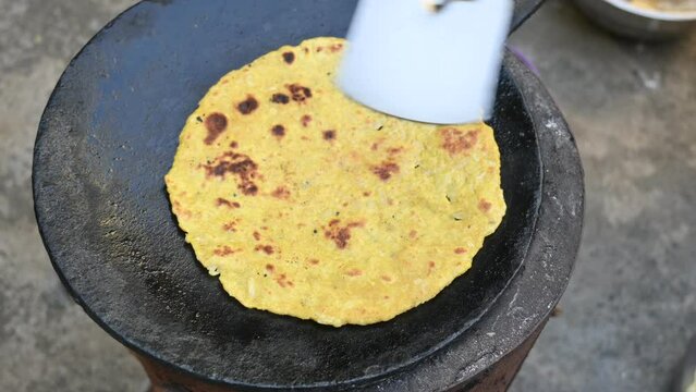 Making Mooli paratha or Radish flatbread. Healthy Indian Mooli paratha. Daikon flatbread. It is a popular food of india. It can be eaten for breakfast, lunch and dinner. Indian food. 
