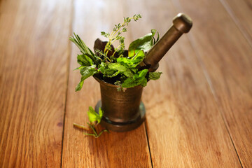 herbs in a wooden mortar