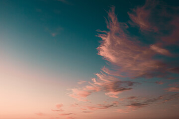 Beautiful pastel sunset of blue and color of the year 2024, Peach Fuzz.