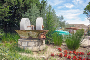 Ancient olive oil production machinery, stone mill and mechanical press. Provence in the South of...