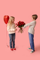 Little boy greeting girl with roses on pink background. Valentine's Day celebration