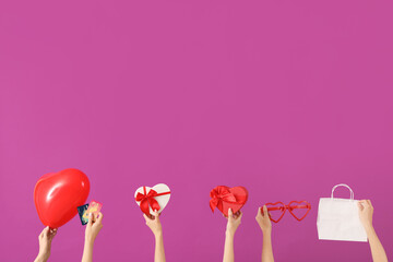 Women with balloon, credit cards, gifts and shopping bag on purple background. Valentine's Day celebration