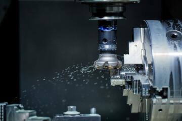 vertical milling machine close-up processes a part in production, modern equipment for metal...
