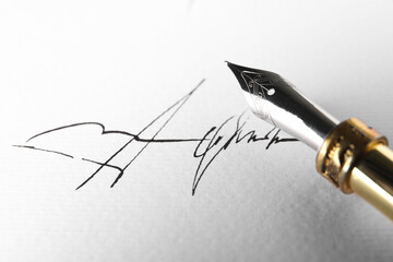 Sheet of paper with fountain pen and signature, closeup - obrazy, fototapety, plakaty