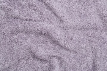 Crumpled terry towel as background, top view