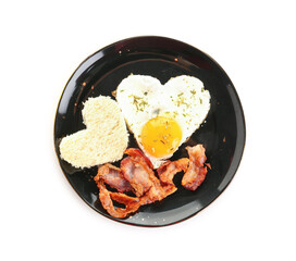 Plate with tasty bacon, hearts made of fried egg and bread piece on white background