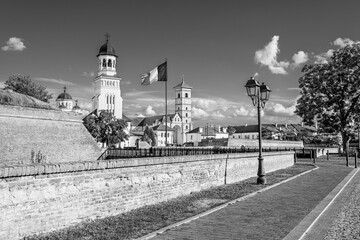 Fototapeta premium The coronation orthodox cathedral and the catholoc cathedral inside Alba Carolina citadel in Alba Iulia, Transylvania, Romania in black and white
