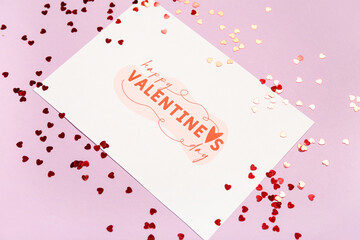 Fototapeta na wymiar Card with text HAPPY VALENTINE'S DAY and red hearts on lilac background