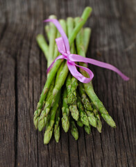 Bunch of fresh green asparagus spears tied with ribbon