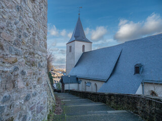 Old church photographed with a steeple on a mountain road