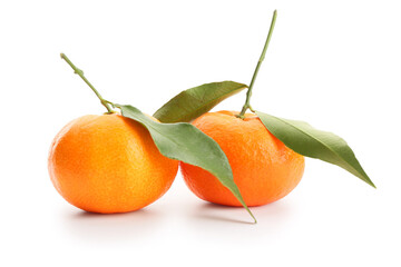 Fresh tangerines with green leaves on white background