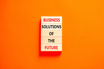Business solutions of the future symbol. Concept words Business solutions of the future on wooden blocks. Beautiful orange table orange background. Business solutions of the future concept. Copy space