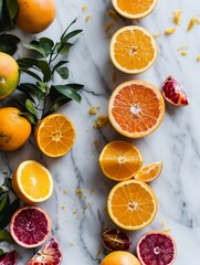 A colourful array of citrus slices with fresh droplets on a clean bright background.