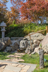 Traditional Japanese lamp Japanese Kasuga-toro lantern made of stone. Close-up. Element of traditional Japanese architecture of Chinese origin. Japanese garden in Krasnodar park or Galitsky park