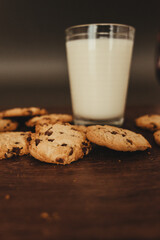 Savoring Simplicity: Homemade Cookies with a Glass of Milk on an Elegant Wooden Table.