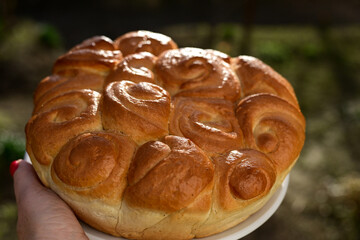 Close-up of fresh  traditional  artisan homemade round  bread . Bulgarian tradional holiday bread