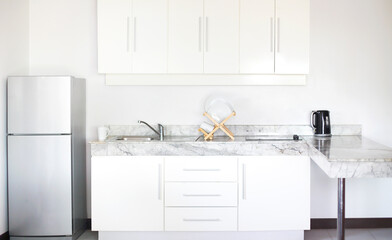 Kitchen interior in a new modern apartment in scandinavian style - obrazy, fototapety, plakaty