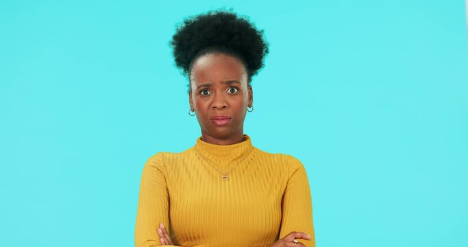 Portrait of black woman in doubt, confusion and angry head shake in no gesture isolated on blue background. Frustrated, dislike and difficult choice for African model in studio with negative face.
