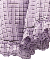 Violet dress frills isolated on white background. Checkered dress.