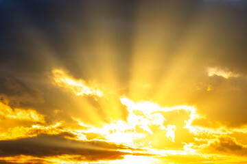 Sunset sky with sunset clouds, sun rays and dramatic sky