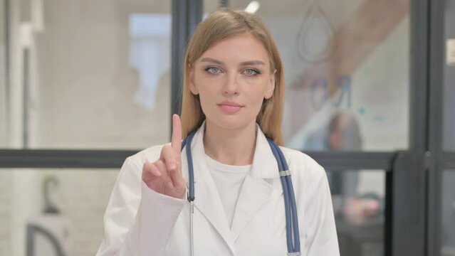 Portrait of Rejecting Blonde Female Doctor in Denial
