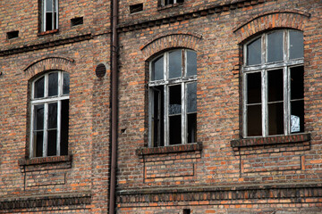 Facade of an old destroyed and abandoned factory.