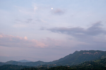 moon and clouds over the mountains