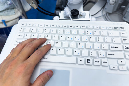 computer keyboard with backlight, on a modern desk