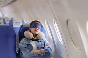  Female passenger sleep on plane flight - obrazy, fototapety, plakaty