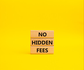 No Hidden Fees symbol. Concept words No Hidden Fees on wooden blocks. Beautiful yellow background. Business and No Hidden Fees concept. Copy space.