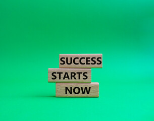 Success Starts Now symbol. Concept words Success Starts Now on wooden blocks. Beautiful green...