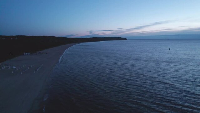 Beachside Reverie: A Captivating Drone View of Sunrise in Sopot, Poland, Unveiling Nature's Morning Symphony