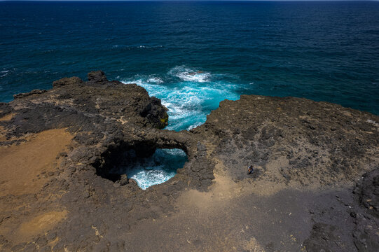 Aerial HDR view of 'Pont Naturel' which is a natural bridge formed by lava many years ago on the south coast of Mauritius island.