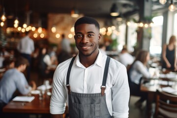 happy african american man waiter in restaurant, cafe or bar - obrazy, fototapety, plakaty