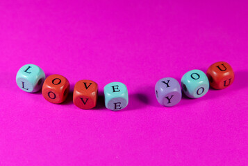 Love You written with wooden cubic beads