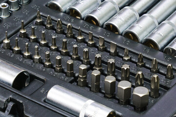Tool box, tool kit closeup with set of hex, torx and screwdriver bits and ratchet heads