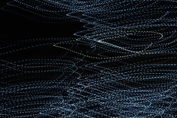 Random trajectories of light. Digital chaos. Chaotic beams of light. Digital flow illustration. White and blue glowing lines. Led effect.