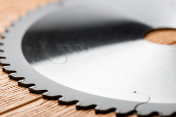 circular saw blade close-up. circular saw on a wooden table.
