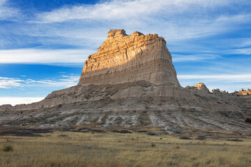 Fototapeta premium Scotts Bluff National Monument Nebraska landscape in winter at sunset with blue sky and clouds. 