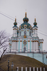 Fototapeta na wymiar Kyiv, Ukraine - January 2, 2024: A beautiful church stands on Andriivskyi Uzvoz. St. Andrew's Church was opened in 1767.