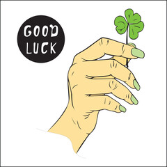Female holding beautiful green four-leaf clover, close-up. Have  good day. Turn green. hand holds clover leaf for good luck.