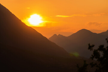 Colorful sunset on top of Italian mountain alps. Beautiful mountain landscape