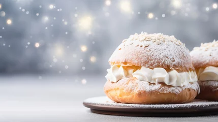 Foto op Aluminium Traditional Swedish Semla bun on sparkling festive background with copy space. Dessert served in Scandinavia during winter. Delicious pastry with whipped cream and powdered sugar. © Studio Light & Shade