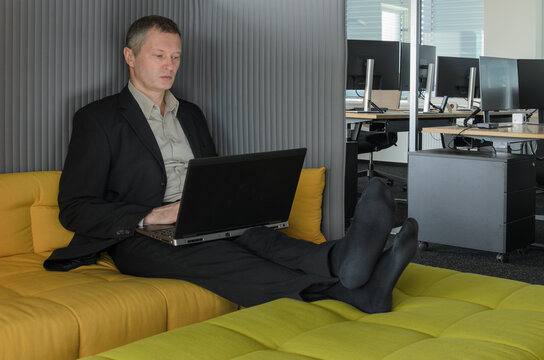 employee relaxes in the IT office chillout area