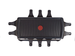 Raclette and grill isolated on white background. Raclette and grill close-up.